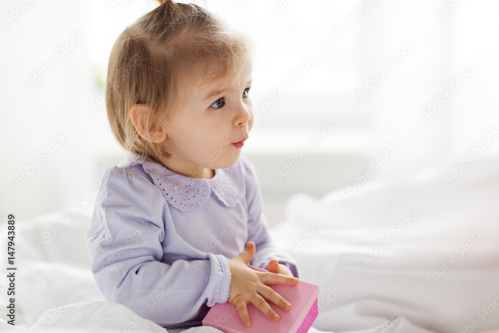 happy little baby girl with gift box at home happy little baby girl with gift box at home