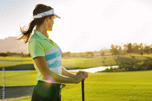 Professional female golfer looking away