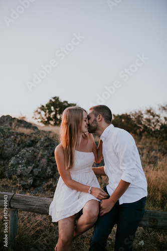 Young couple kissing outdoors 