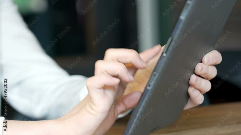 Girl's hands touching screen on tablet while browsing internet, steadycam shot
Girl's hands touching screen on tablet while browsing internet, steadycam shot