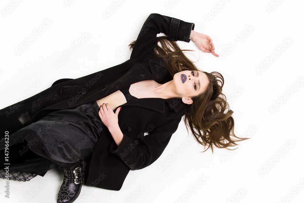 attractive girl with beautiful hairstyle in coat has black makeup attractive girl with beautiful hairstyle in coat has black makeup
