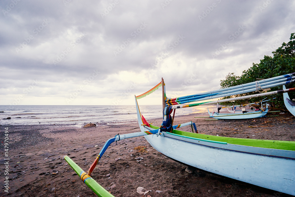 Beautiful landscape. Ocean, beach and indonesian fishing boats. Beautiful landscape. Ocean, beach and indonesian fishing boats.