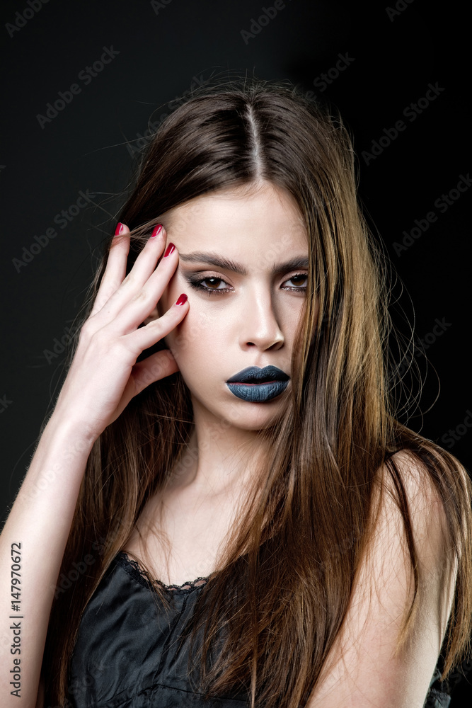 girl has fashionable lips makeup, long hair and red manicure girl has fashionable lips makeup, long hair and red manicure