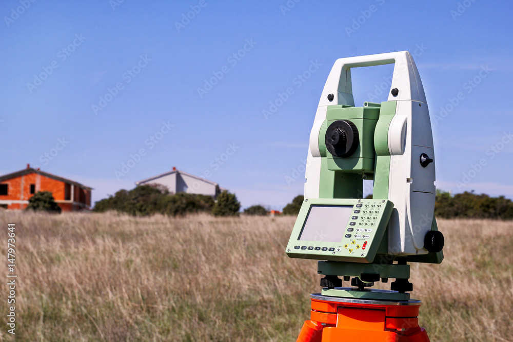 Total station. Survey Instrument geodetic device. Fall time land surveying, total station set in the field. Total station. Survey Instrument geodetic device. Fall time land surveying, total station set in the field.