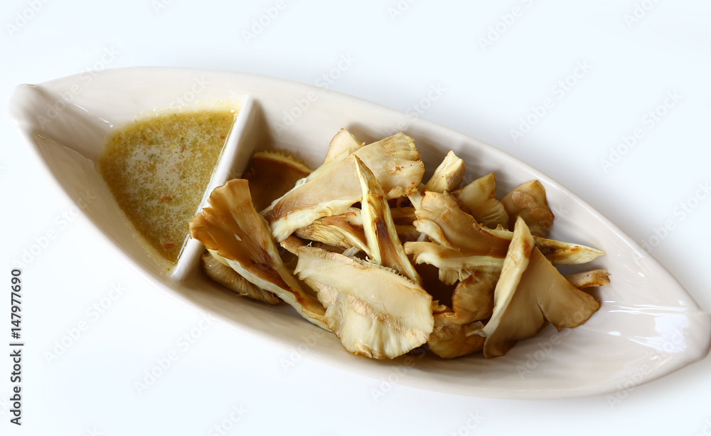Grilled mushrooms in plate with spicy sauce. Grilled mushrooms in plate with spicy sauce.