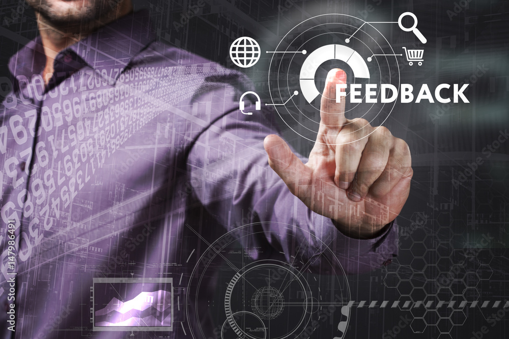 Business, Technology, Internet and network concept. Young businessman working on a virtual screen of the future and sees the inscription: Feedback Business, Technology, Internet and network concept. Young businessman working on a virtual screen of the future and sees the inscription: Feedback