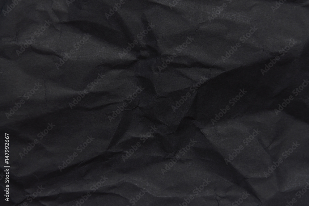 Fototapeta premium The background paper, crumpled black