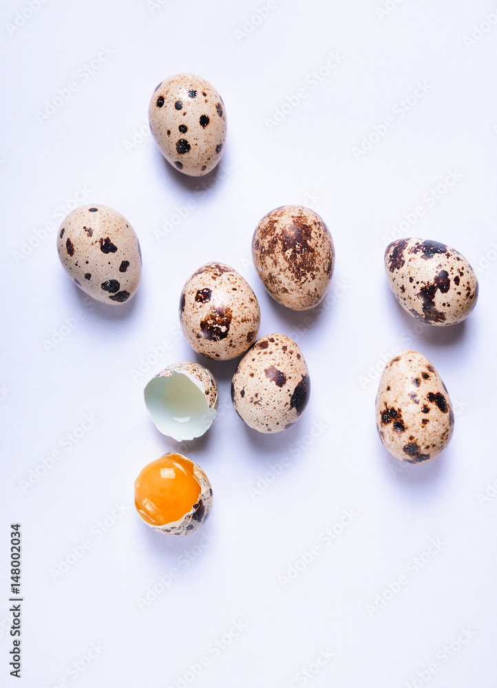 Fresh quail eggs on a white surface Fresh quail eggs on a white surface