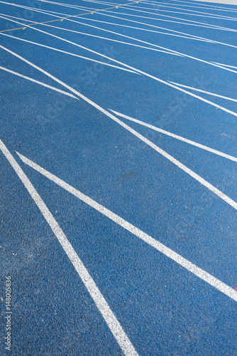 close up view of blue running track on olympic stadium