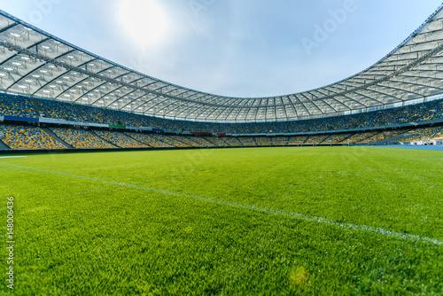Panoramic view of soccer field stadium and stadium seats photo