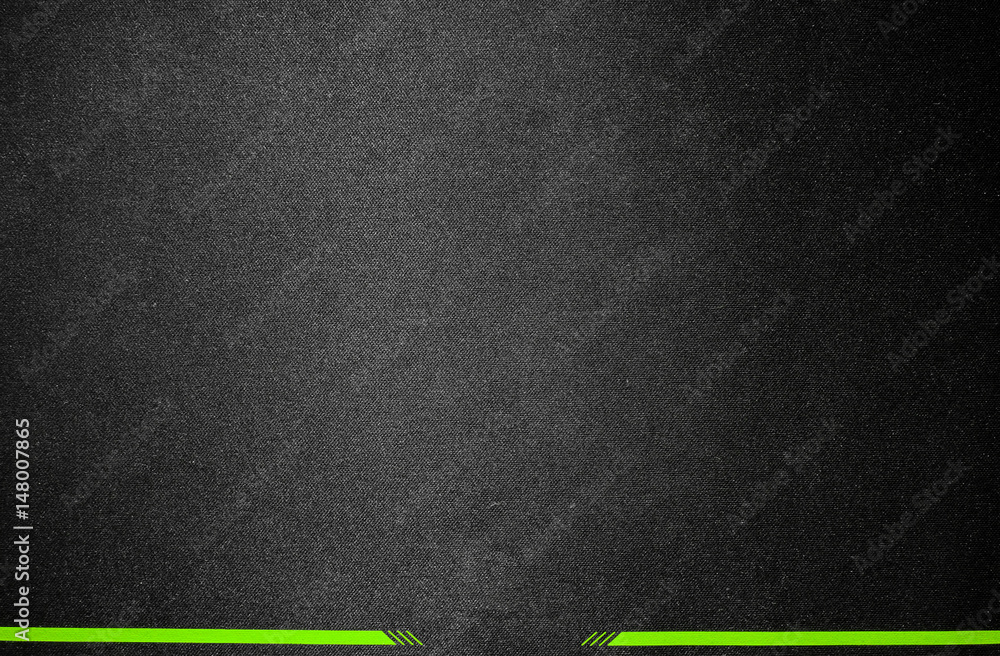 Black fabric background with green stripes. Black fabric background with green stripes.