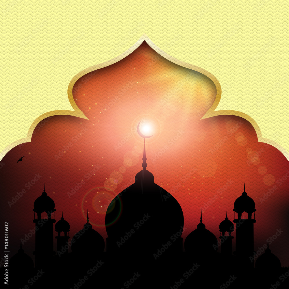Silhouette of a mosque at sunrise. The perfect backdrop for greetings Ramadan Kareem.