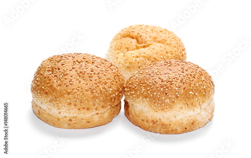 Three burger buns with sesame isolated on white background