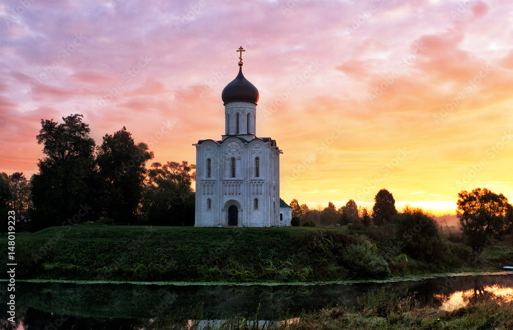 Beautiful sunrise over Church of the Intercession of the Holy Virgin on  Nerl River, Bogolyubovo, Russia