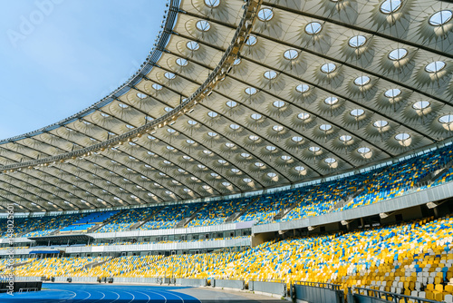 rows of yellow and blue stadium seats on olympic stadium photo