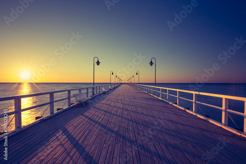 Amazing sunrise on the pier at the seaside. Gdynia Orlowo  Poland