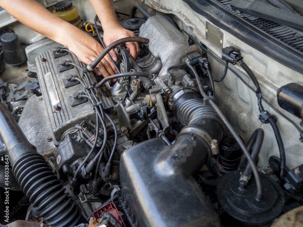 Car mechanic working in auto repair service Car mechanic working in auto repair service