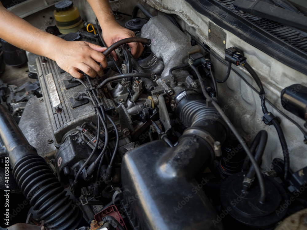Car mechanic working in auto repair service Car mechanic working in auto repair service