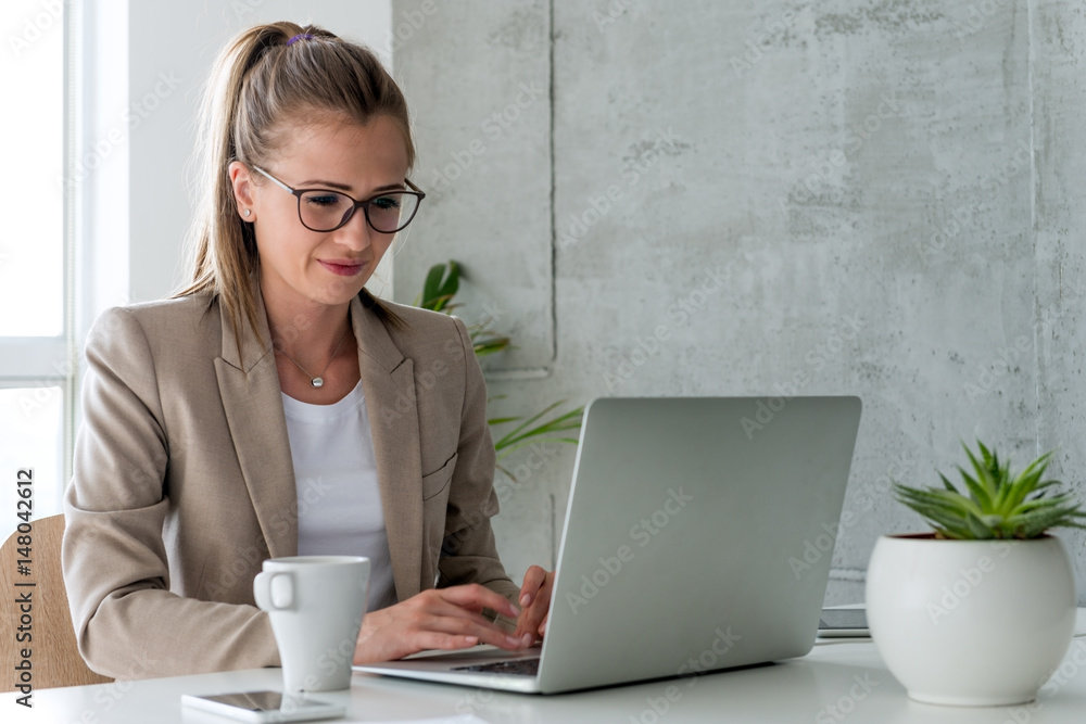 © Stock Rocket - Businesswoman Typing on laptop