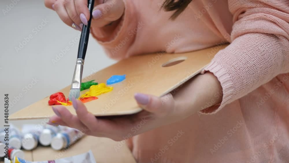 Girl mixing up colours. No face.4K. Girl mixing up colours. No face.4K.