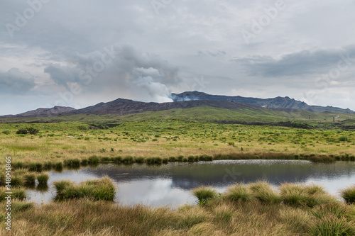 Powerful erupting Mount Aso with little pond in Kumamoto, Japan