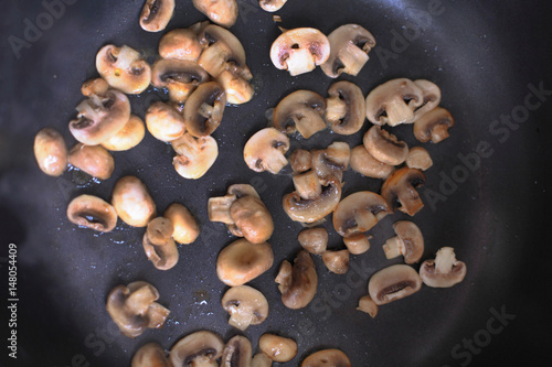 Fried mushrooms in a frying pan.