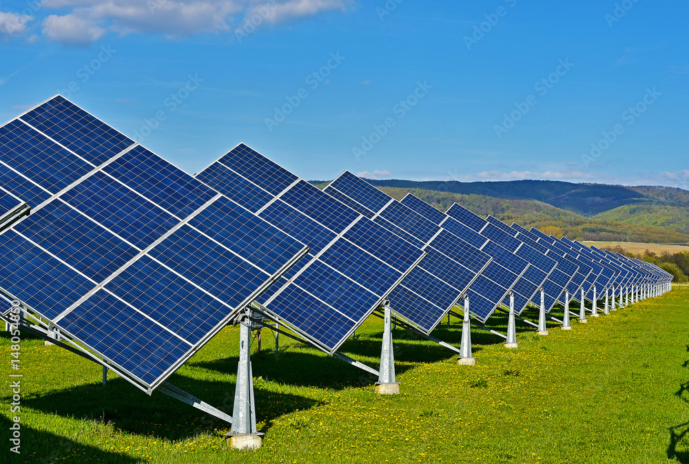 Green energy - photovoltaic power plant on green meadow Green energy - photovoltaic power plant on green meadow