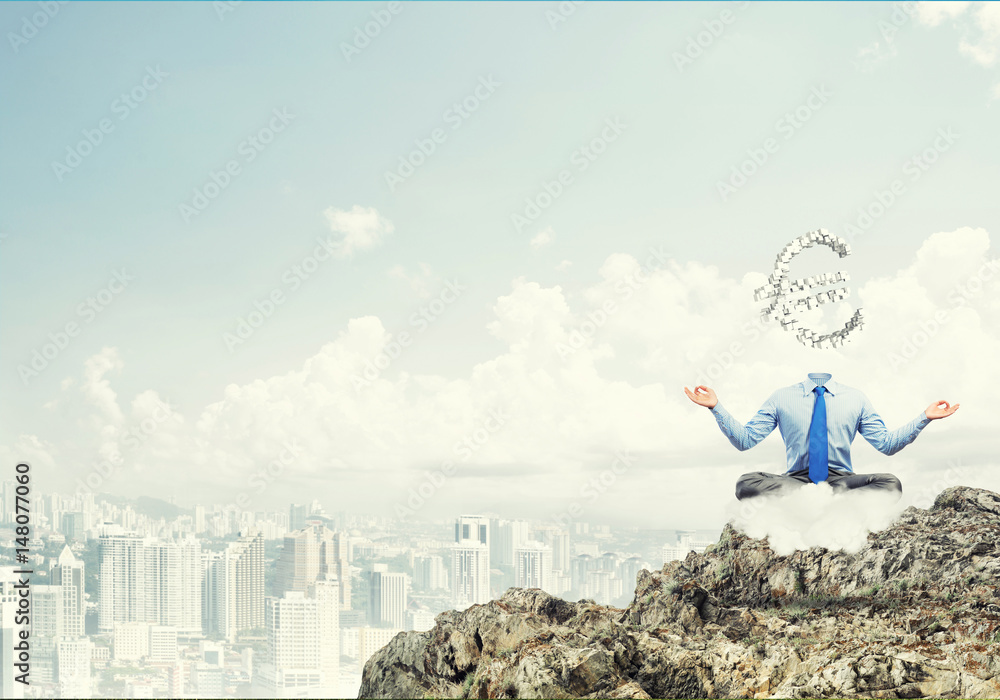 Headless meditating businessman Headless meditating businessman