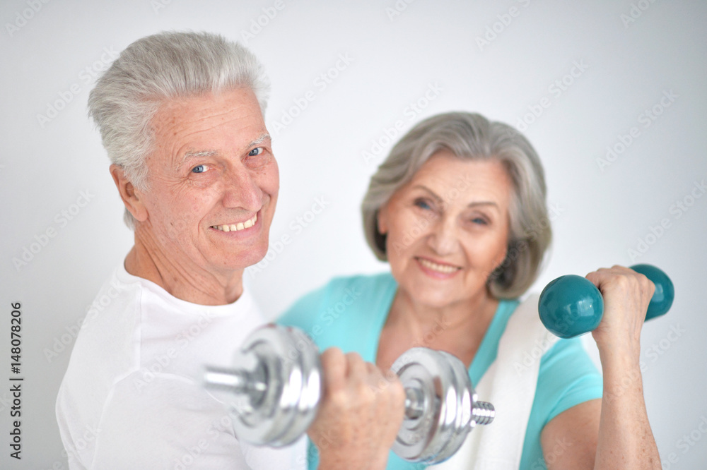 Beautiful elderly couple in a gym Beautiful elderly couple in a gym