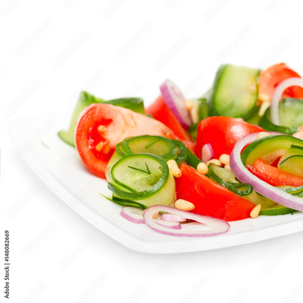 Fresh vegetable salad with pine nuts isolated on white Fresh vegetable salad with pine nuts isolated on white