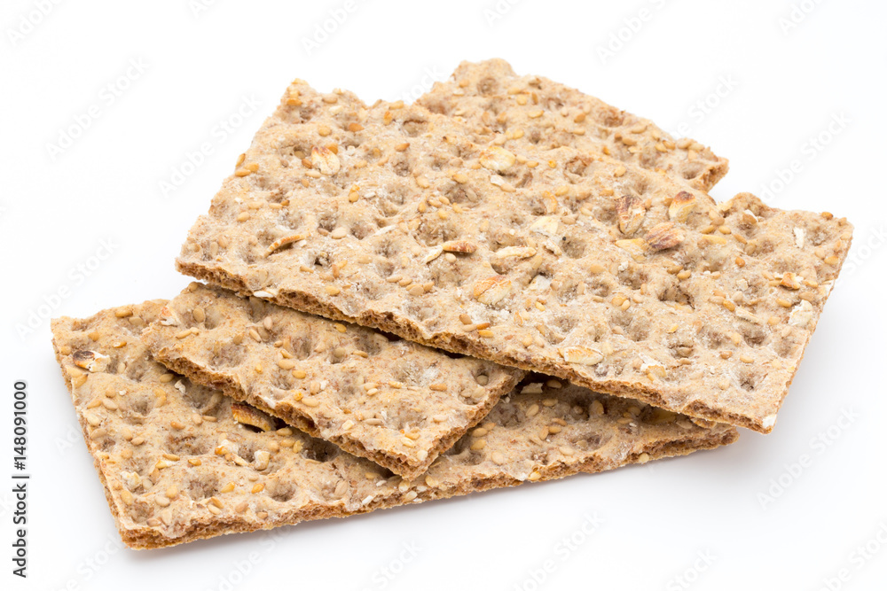 Stack of wholegrain crispy bread with sunflower, chia and sesames seeds Stack of wholegrain crispy bread with sunflower, chia and sesames seeds