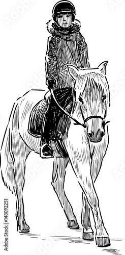 A kid riding a horse
