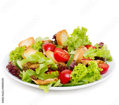 Caesar salad with grilled chicken isolated on white