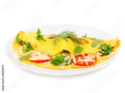 omelet with cheese, broccoli and tomatoes on white