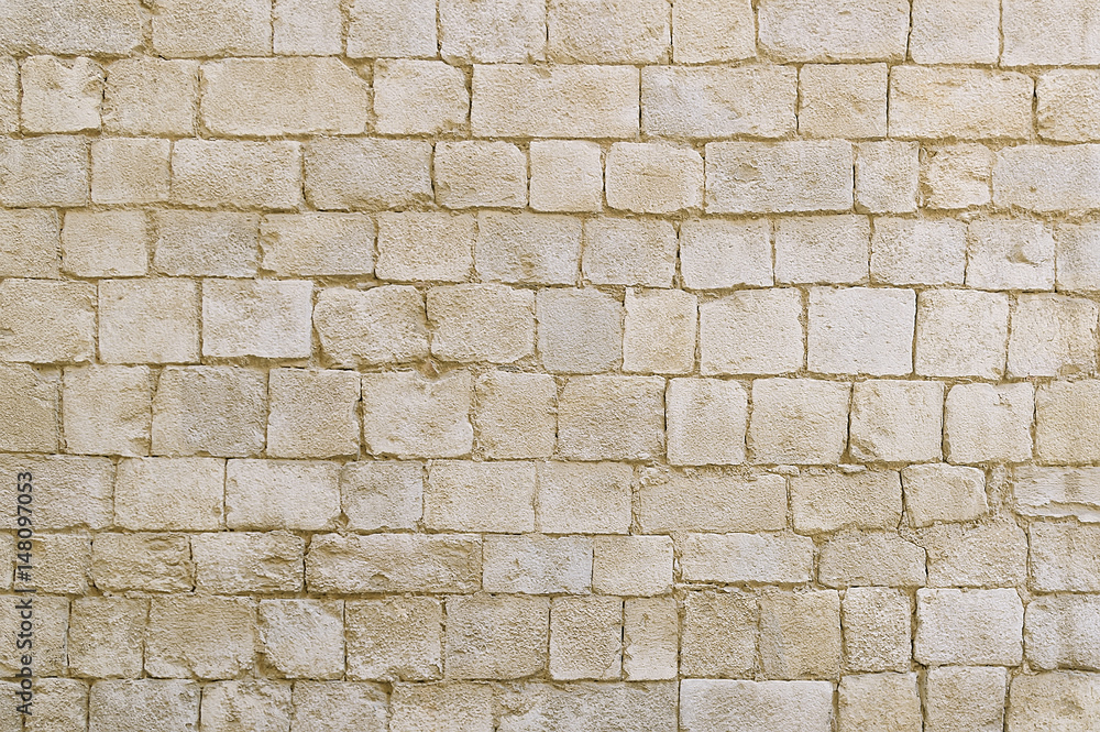 Old beige stone wall background texture Old beige stone wall background texture