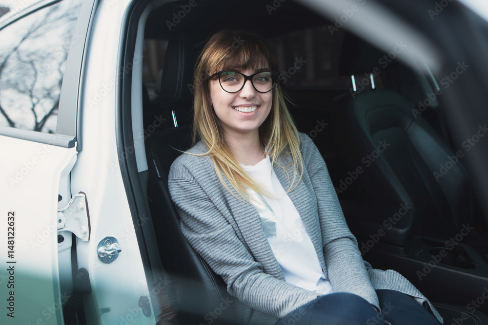 Fototapeta premium successful young woman in the car