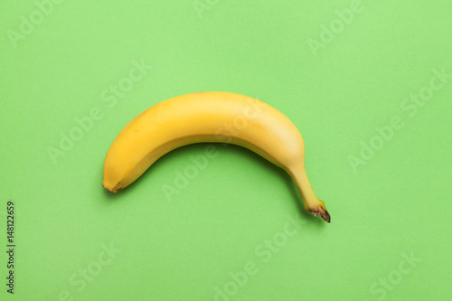 ripe banana on a green background