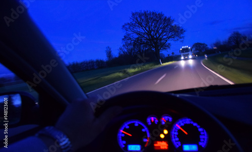 Nachtfahrt auf Landstraße. Mit LKW als entgegenkommer.  photo