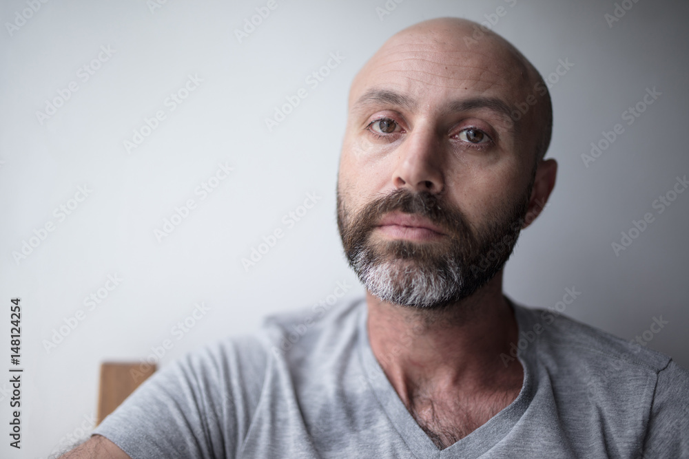 Mid forties depressed man in bed at home Mid forties depressed man in bed at home