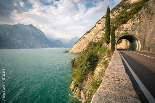 Road passing through tunnel by the Lake Garda photo