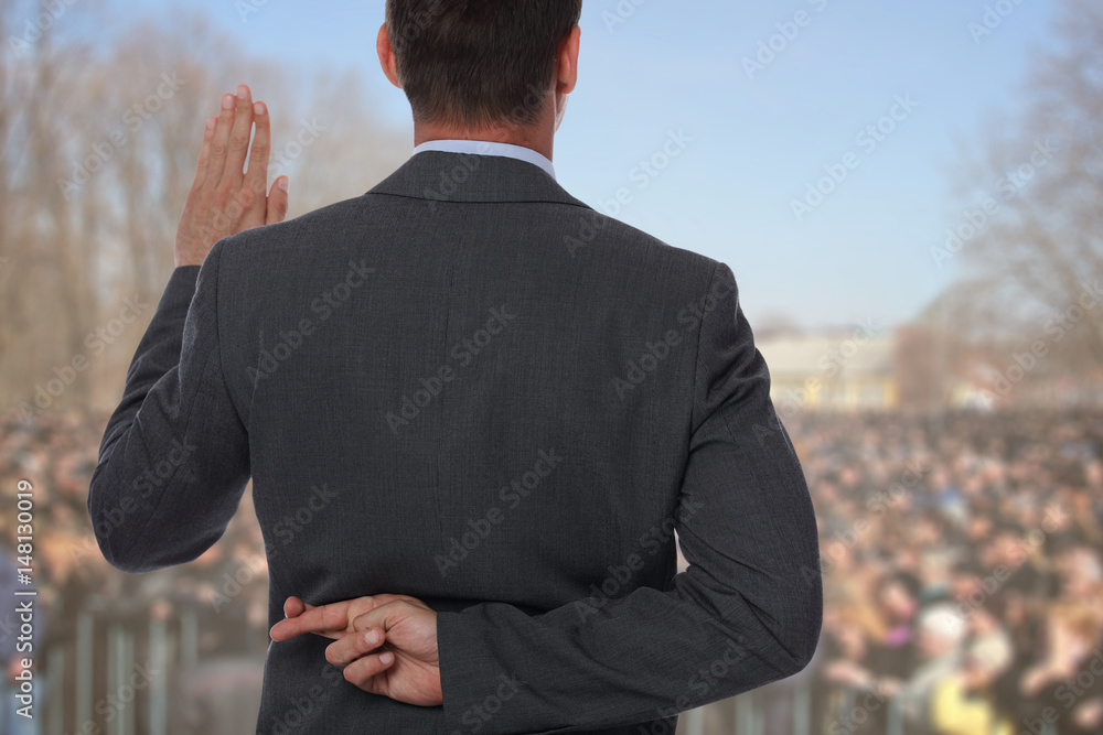 Politician liar gives people impossible promises with fingers crossed on  his back. Stock Photo | Adobe Stock