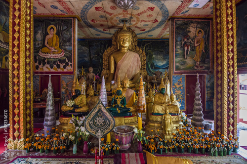 Gold Buddha statue inside the Wat Luang - buddhist temple in Pakse, Champasak province, Laos