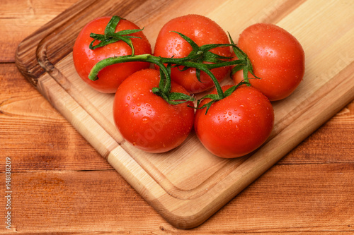 healthy lifestyle, vegetarianism , diet and fitness, red tomatoes vine