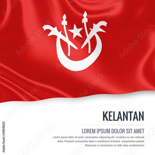Kelantan flag. Flag of Malaysian state Kelantan waving on an isolated white background. State name and the text area for your message. 3D illustration. photo