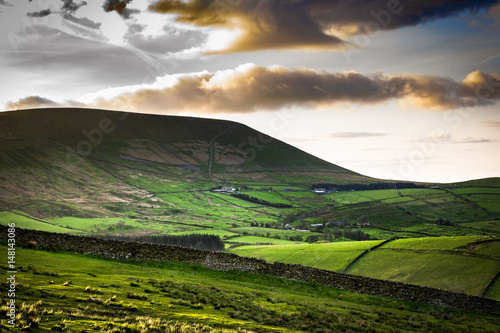 Scenic View On Pendle Hill At Springtime, afternoon sunlight casting shadows on the hills, Lancashire, England UK