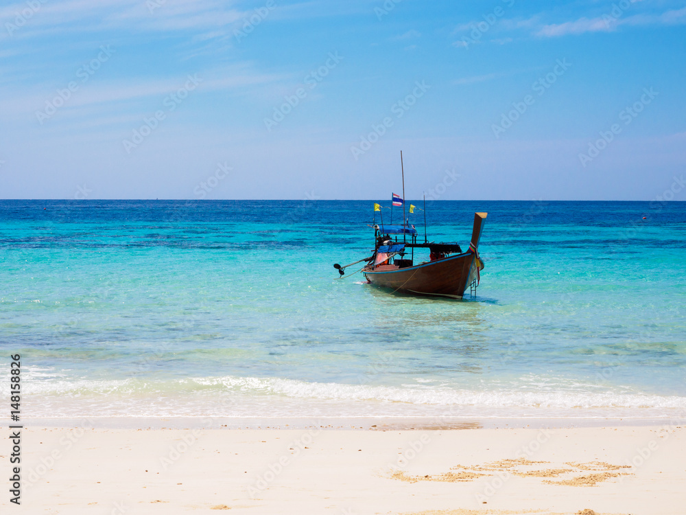 Longtail boat at the beach on Koh Rok island in southern Thailand