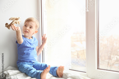 Cute little boy playing on ...