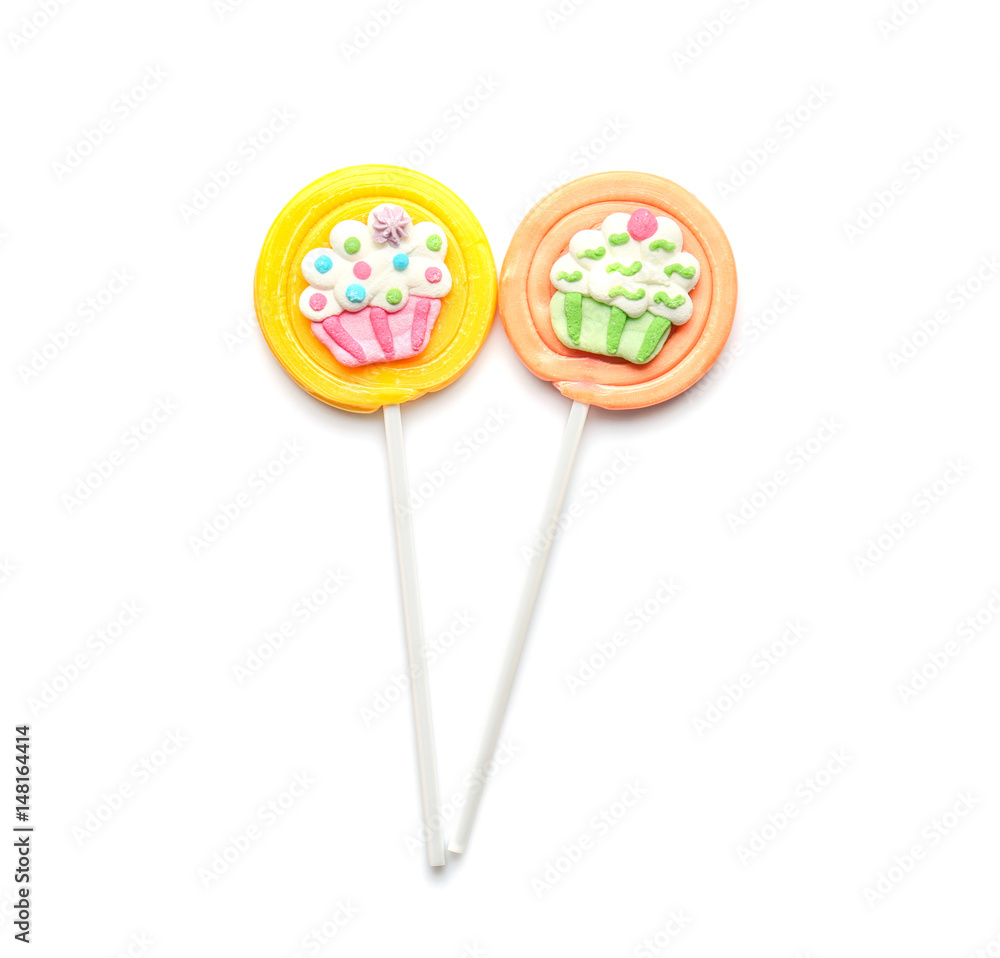 Tasty colorful lollipops on white background