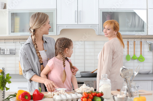 Young woman, her daughter a...