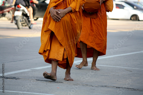 Buddhist monks walking for receive food from the people 